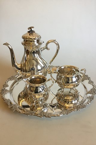 Coffee set in Silver Plater and round Art Nouveau packet in Nickel Silver with grape decoration. Coffee pot, Sugar Bowl and Creamer.