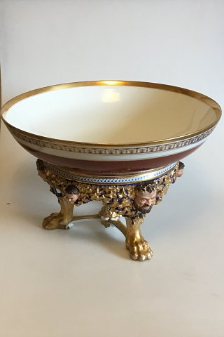 Bing og Grondahl Punch Bowl on stand of porcelain, decorated in red, blue and gold. Stand with modeled leaves, faun and buck heads, standing on three animal paws style of Heinrich Hansen