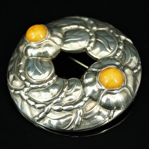 Georg Jensen; A brooch of sterling silver set with amber #42, anniversary brooch 
1904 - 1994
