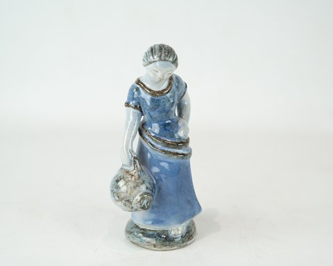 Stoneware figure with light blue glaze by L. Hjorth.
5000m2 showroom.
