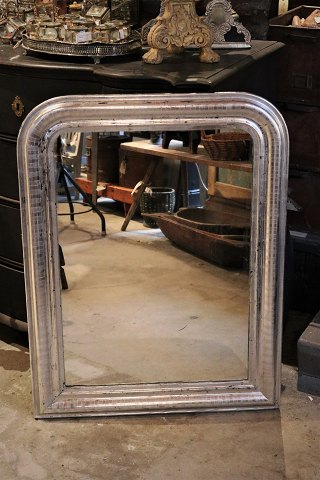 French 1800 century Louis Philippe silver fireplace mirror with fine decorated 
frame and original old mirror glass and fine patina.
H:93cm. W:71cm.

