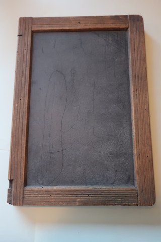 An old blackboard/slate mad of slate with an edge of wood