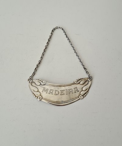 Bottle label in silver with the text "Madeira"