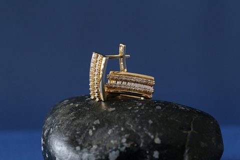 Earrings in 14 carat gold, stamped 585,with clear stones.