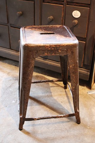 Original old French Tolix stool with extra height in polished metal with 
fantastic fine patina. H: 55cm.