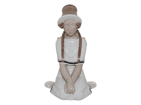 Sjælden Royal Copenhagen figur
17 år af Arno Malinowski i overglasur og med guld