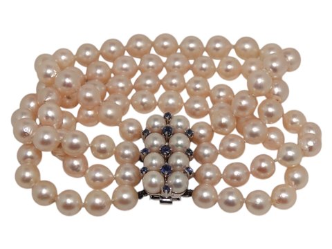 Double row pink Akoya pearl bracelet with 14 carat white gold pendant with 
sapphires