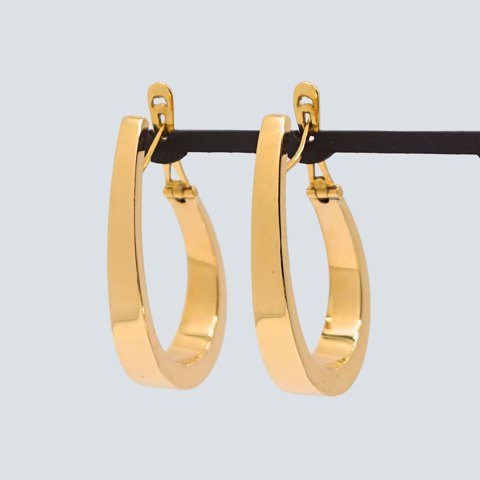 Pair of large earrings in 18k gold