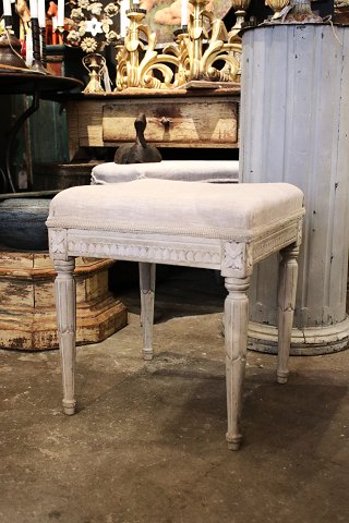 19th century Gustavian stool in wood with a fine grey patina and seat upholstered in linen...