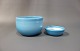 Two different sized glass bowls with a blue glaze on the outside and White on the inside from Holmegaard and the series Palet.5000m2 showroom.