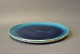 Ceramic plate/round dish with a dark blue glaze by Herman A. Kähler.5000m2 showroom.
