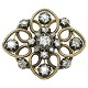 Broche af 14 kt. guld og hvidguld prydet med diamanter og brillanter