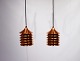 A pair of Duett copper pendants designed by Bent Boysen in the 1970s.
