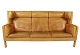 Trepersoners sofa, model Kupe, af Børge Mogensen og polstret med lys cognac 
farvet læder.
5000m2 udstilling.
