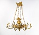 French church chandelier of bronze with beautiful decorations and eight arms for candle lights from around the 1880s.5000m2 showroom.