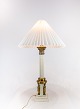 Old french Table lamp in brass decorated with different figurines from the 
1920s.
