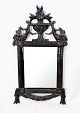 Rococo mirror with black painted wooden frame with carvings, in great antique 
condition from the 1780s.
