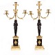 A pair of fire gilt Empire bronze candelabra. France circa 1820. H: 51cm
