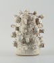 Christina Muff, Danish contemporary ceramicist (b. 1971). 
Large unique stoneware sculpture in offwhite glaze with ironcovered specks.
Measuring: W 23 x H 29 cm.