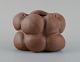 Christina Muff, Danish contemporary ceramicist (b. 1971). Dark brown unglazed vessel. Organic shaped vase with lips. Clear glaze inside.