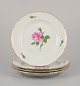 Meissen, 
Germany. Four 
dinner plates 
with a motif of 
a ...