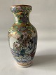 Tall slim Chinese vase in classic style.
Height: 15 cm.