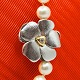 Ole Lynggaard, Charlotte Lynggaard; Clasp of 14k white gold with a diamond