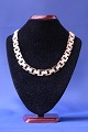 Block necklace with embossing in the middle row. Stamped CHL 585