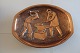 An old oval plate made of brass
Relief which illustriert 2 blacksmith working 
together
H: 13cm
W: 16,5cm
Heavy
Made in Denmark
In a very good condition