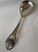 Serving spoon in silver.
Length 24 cm.
Produced Year.1952