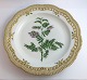 Royal Copenhagen, Flora Danica. Tallerken med gennemskåret bort. Design #3574. Diameter 29 cm. (1 sortering). Vicia Orobus