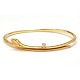 An oval 18kt gold "Snakes"-bangle by Ole Lynggaard, Copenhagen. Size inside: 
5,9x4,8cm