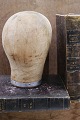 Decorative, old French hat head made of wood and covered with raw fabric...