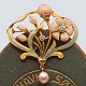 An Art Nouveau brooch in 18k gold with enamel, diamonds and pearl