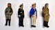 Collection of 
German bisque 
hand-painted 
military brooch 
...