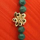 Ole Lynggaard, Charlotte Lynggaard; Clasp of 18k gold, set with a diamond