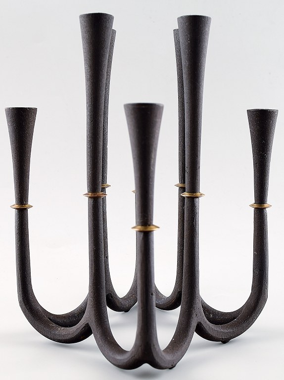 Rare Jens Quistgaard candlestick in cast iron for 8 lights.