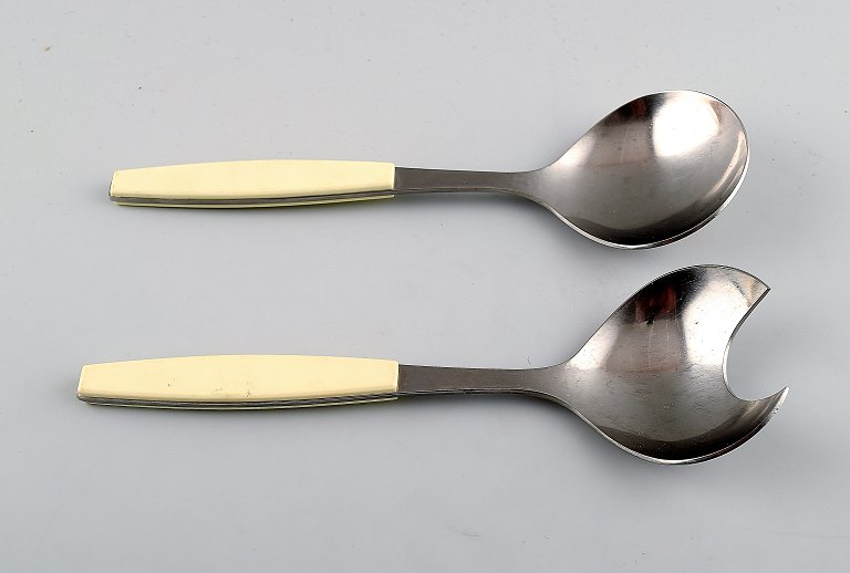 Henning Koppel. Strata salad set of stainless steel and white plastic.Produced by Georg Jensen.