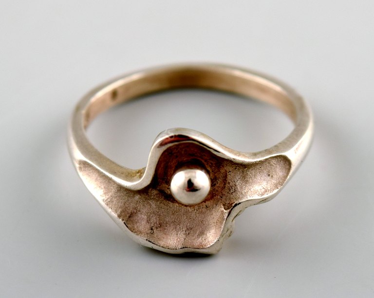 N.E. From sterling silver ring with stone.