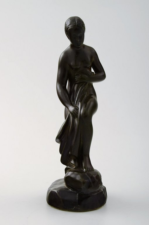 Figure of half-naked woman, designed by Just Andersen.