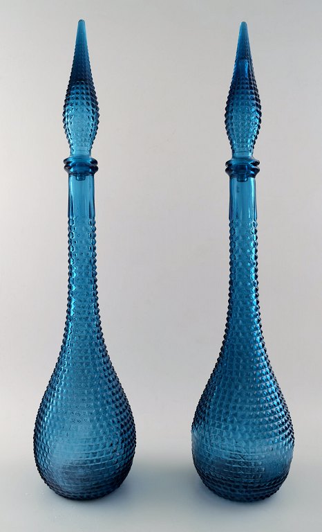 A pair of very tall turquoise decanters. Venini style. 1960 / 70s.