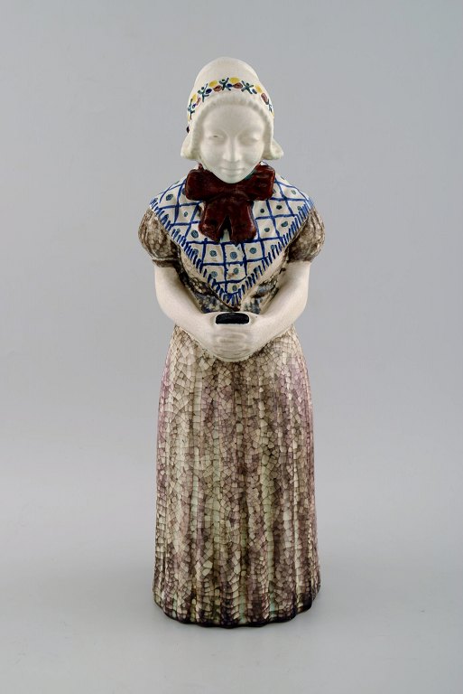 Michael Andersen Ceramics from Bornholm.Large figure of woman with Songbook in national dress.No. 4418-3.