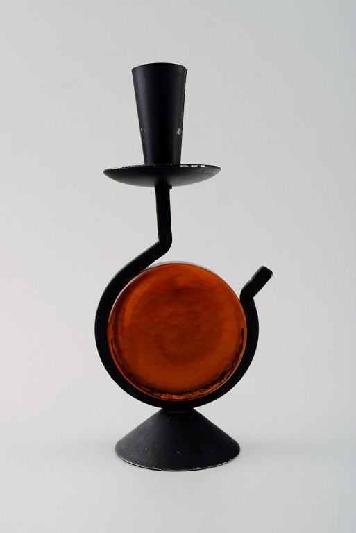 Erik Höglund for Kosta Boda, candlestick of cast iron with hand-blown art glass. Sweden 1970s.