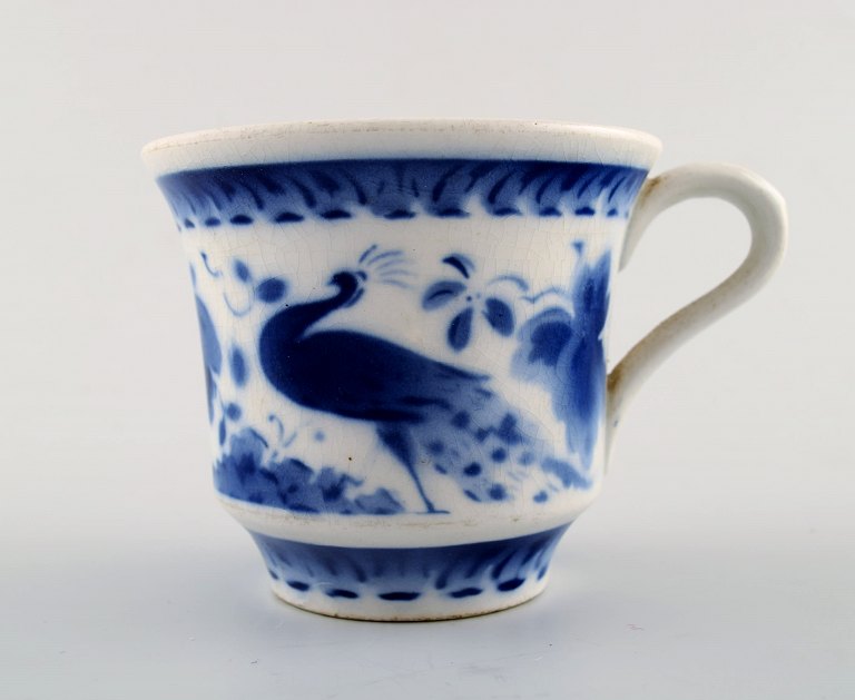Peacock from Copenhagen faience / Aluminia.Coffee cup in faience.