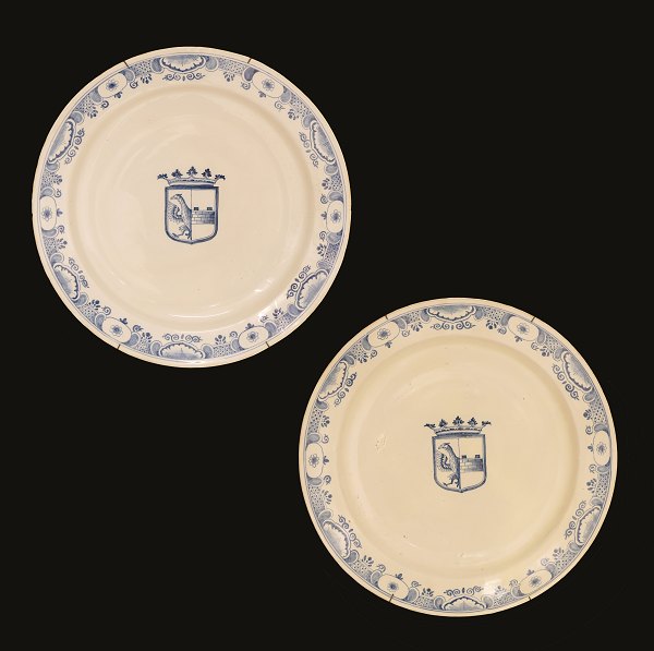 A pair of large faience plates. Signed Stockholm, Sweden, circa 1750. With the coat of arms of the family von Berchs. D: 39,5cm