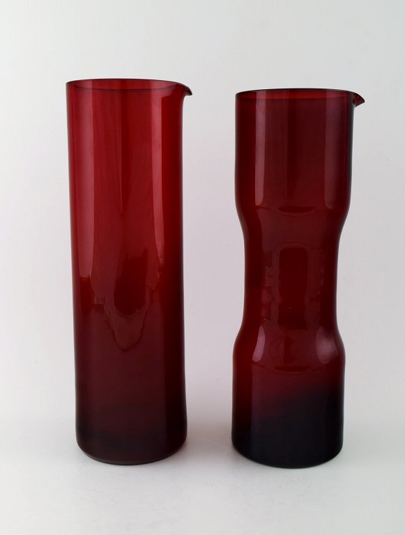 Kaj Franck (Finnish, 1911-1989) Nuutajärvi Glass Works, Finland, art glass. Two pitchers of red art glass.