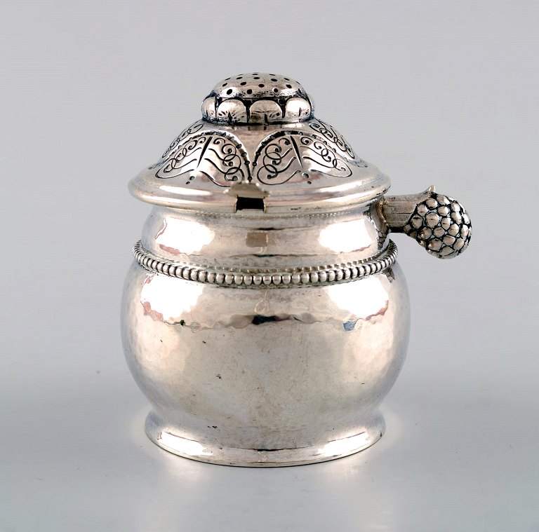Mustard pot by Evald Nielsen, Denmark in hammered silver with organic ornamentation.