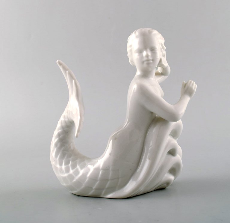 Harald Salomon for Rörstrand, hvidglaseret figur forestillende faun/pan.  
