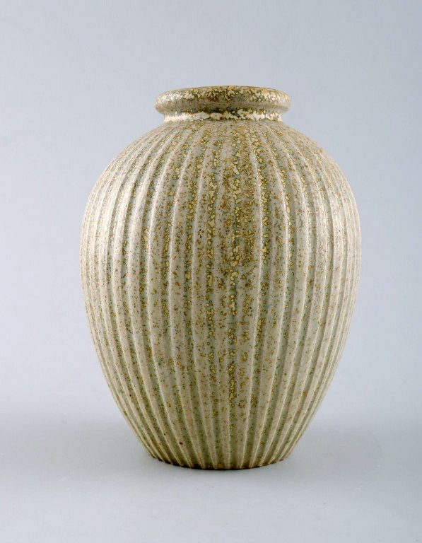 Arne Bang. Ceramic vase in ribbed style.Stamped AB 124.