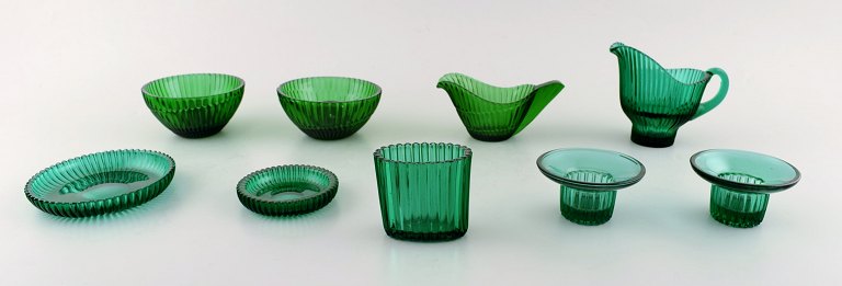 Arthur Percy for Nybro Sweden. Collection of green art glass. 9 pieces, 2 pairs of candle sticks, creamers, etc.